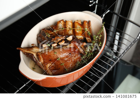 Delicious roasted ribs with thyme in oven Delicious roasted ribs with thyme in oven 141081675