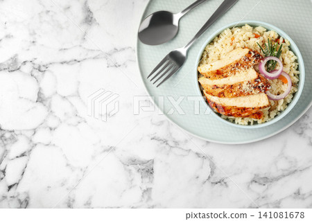 Delicious chicken risotto served on white marble table, top view. Space for text 141081678
