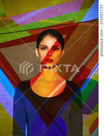 Surreal, abstract and portrait of woman by color, art and pattern of shapes serious for creative career. Light, female person and lady by wall with face for cosmetics, beauty and makeup or skin care Surreal, abstract and portrait of woman by color, art and pattern of shapes serious for creative career. Light, female person and lady by wall with face for cosmetics, beauty and makeup or skin care 141081723