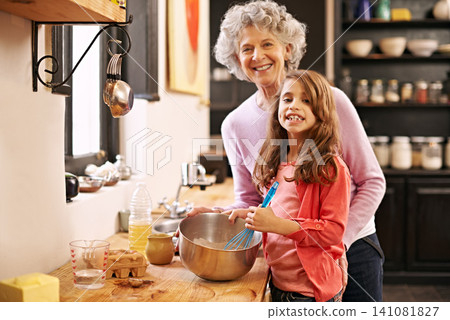 Cooking, mix or portrait of grandmother with child in kitchen teaching a recipe for support or learning in home. Family, baking or girl with bowl, grandma or elderly woman for dinner, supper or lunch Cooking, mix or portrait of grandmother with child in kitchen teaching a recipe for support or learning in home. Family, baking or girl with bowl, grandma or elderly woman for dinner, supper or lunch 141081827