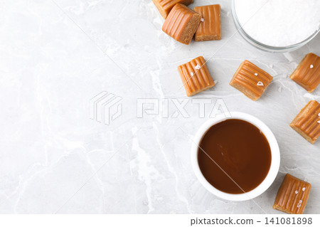 Salted caramel on marble table, flat lay. Space for text Salted caramel on marble table, flat lay. Space for text 141081898