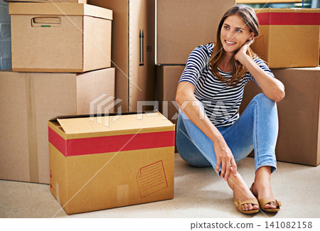 Thinking, smile and woman with boxes in new home for moving to estate, property or apartment. Happy, excited and young female person with cardboard package for equipment and products in modern house. Thinking, smile and woman with boxes in new home for moving to estate, property or apartment. Happy, excited and young female person with cardboard package for equipment and products in modern house. 141082158