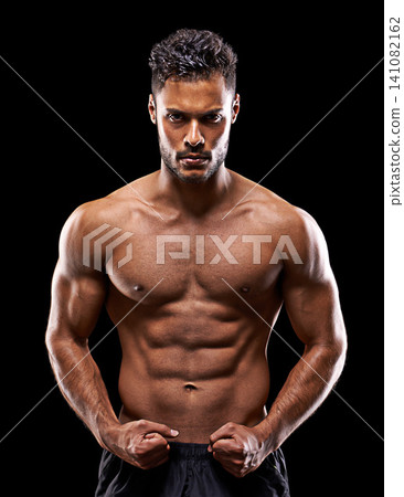 Fitness, portrait and man in studio with muscle, confidence and workout routine in health, wellness and power. Flexing, pride and strong athlete on black background for exercise, results and care 141082162