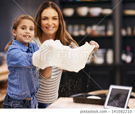 Portrait, mother and child with pizza to bake in a kitchen teaching for help, support or learning in home. Family, tablet or girl cooking bread with parent, kid and mom for dinner, supper or lunch Portrait, mother and child with pizza to bake in a kitchen teaching for help, support or learning in home. Family, tablet or girl cooking bread with parent, kid and mom for dinner, supper or lunch 141082210