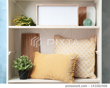 White shelving unit with different decorative stuff White shelving unit with different decorative stuff 141082406