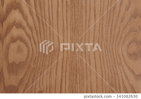 Horizontal top down flat lay shot of a dark brown walnut wooden veneer texture sheet with beautiful prominent natural grain curves for furniture decoration Horizontal top down flat lay shot of a dark brown walnut wooden veneer texture sheet with beautiful prominent natural grain curves for furniture decoration 141082630
