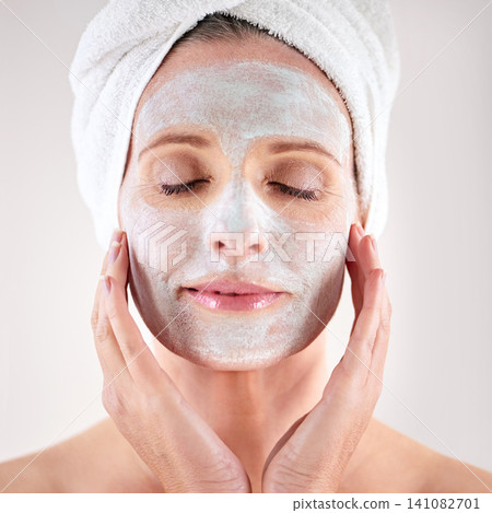 Spa, mask or woman in studio for facial or skincare routine with natural detox or cosmetics with towel. Model, female person or face with lotion for anti aging treatment or beauty on white background 141082701