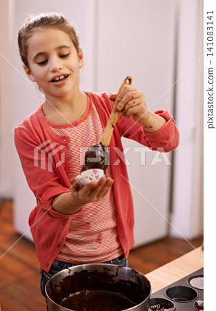 Child, bake and cupcake for learning, dessert and pastry for sugar, cake and sweet. Little girl or kid and smile with chocolate and utensils in kitchen for joy, childhood and delicious for fun Child, bake and cupcake for learning, dessert and pastry for sugar, cake and sweet. Little girl or kid and smile with chocolate and utensils in kitchen for joy, childhood and delicious for fun 141083141