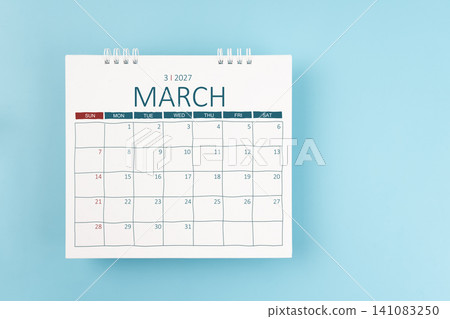 March 2027 Monthly desk calendar for 2026 year on blue color background. Flat lay. March 2027 Monthly desk calendar for 2026 year on blue color background. Flat lay. 141083250