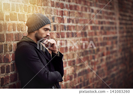 Fashion, man and thinking in brick wall outdoor with trendy, cool and style for urban with idea. Male person, choice and planning for weekend or holiday with winter outfit and stylish in Germany Fashion, man and thinking in brick wall outdoor with trendy, cool and style for urban with idea. Male person, choice and planning for weekend or holiday with winter outfit and stylish in Germany 141083260