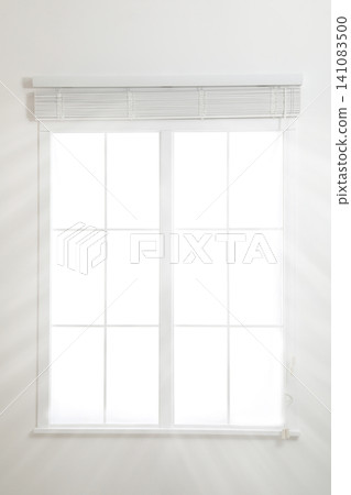 Modern window with open blinds in room 141083500