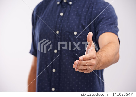 Handshake, closeup and welcome person in studio, background and introduction in mockup space. Hand, gesture and networking for business with confidence and say thank you for agreement or offer Handshake, closeup and welcome person in studio, background and introduction in mockup space. Hand, gesture and networking for business with confidence and say thank you for agreement or offer 141083547