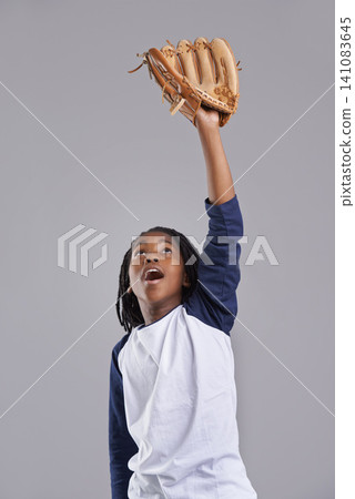 Sports, baseball and child on gray background with glove for training, practice and match. Fitness, youth and excited young boy with equipment for exercise, playing games and training in studio Sports, baseball and child on gray background with glove for training, practice and match. Fitness, youth and excited young boy with equipment for exercise, playing games and training in studio 141083645