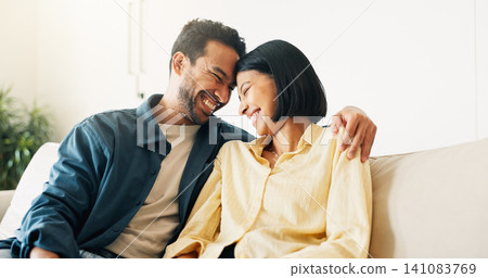 Laugh, relax and couple on sofa in home with bonding, love and connection in marriage on weekend. Forehead touch, happiness and man embracing woman in living room for commitment, care and affection. Laugh, relax and couple on sofa in home with bonding, love and connection in marriage on weekend. Forehead touch, happiness and man embracing woman in living room for commitment, care and affection. 141083769