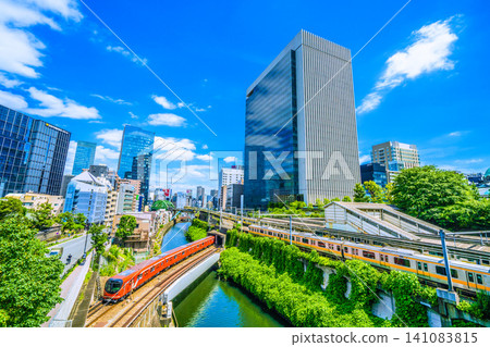 A view of Tokyo's urban landscape, including the new 2000 series trains on the Marunouchi Line, Ochanomizu Station, and trains on various JR lines. A view of Tokyo's urban landscape, including the new 2000 series trains on the Marunouchi Line, Ochanomizu Station, and trains on various JR lines. 141083815