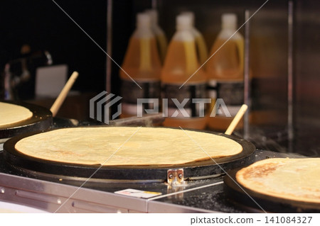 Crepes being baked Crepe wrappers Crepes being baked Crepe wrappers 141084327