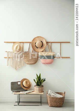Decorative wooden ladder, bench and plant at home. Idea for interior design Decorative wooden ladder, bench and plant at home. Idea for interior design 141084413