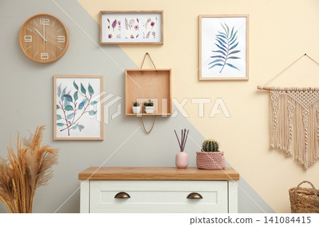 Stylish room interior design with floral paintings Stylish room interior design with floral paintings 141084415