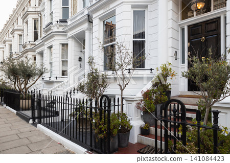Classic white Victorian terraced houses in London Classic white Victorian terraced houses in London 141084423