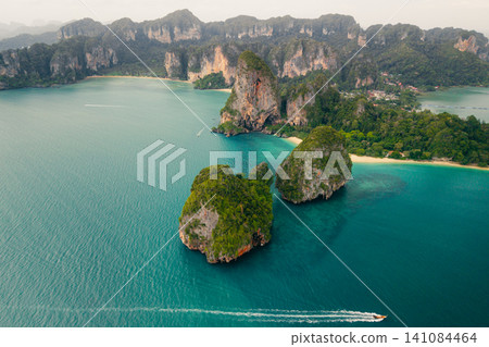 Beautiful aerial view of tropical limestone islands and turquoise bay in Krabi, Thailand. Beautiful aerial view of tropical limestone islands and turquoise bay in Krabi, Thailand. 141084464
