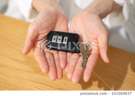 Woman with car keys Woman with car keys 141084637