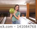 Young woman with ball in bowling club Young woman with ball in bowling club 141084768
