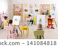 Little children painting during lesson in room Little children painting during lesson in room 141084818