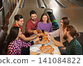 Group of friends with drinks and pizza in bowling club Group of friends with drinks and pizza in bowling club 141084822