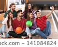 Group of friends taking selfie in bowling club Group of friends taking selfie in bowling club 141084824
