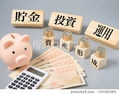 A piggy bank and stacked coins, symbolizing wealth building and regular investment. A piggy bank and stacked coins, symbolizing wealth building and regular investment. 141085065