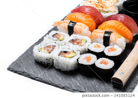 Assorted sushi platter with nigiri and maki rolls Assorted sushi platter with nigiri and maki rolls 141085124