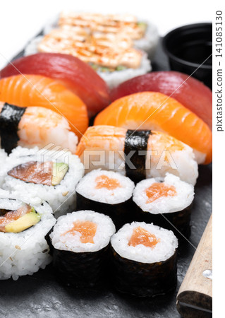 Assorted sushi platter with nigiri and maki rolls Assorted sushi platter with nigiri and maki rolls 141085130