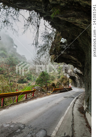 Mountain road under rock tunnel in Taiwan Mountain road under rock tunnel in Taiwan 141085341