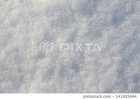 Texture of the white snow. Winter background Texture of the white snow. Winter background 141085664