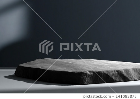 Dark blue minimalist style mockup for product presentation. Aesthetic black granite podium for product placement with beautiful shadows reflected on the empty room wall. 141085875