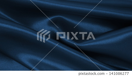 Smooth elegant blue silk or satin luxury texture as abstract background. Luxurious Christmas background or New Year background design Smooth elegant blue silk or satin luxury texture as abstract background. Luxurious Christmas background or New Year background design 141086277