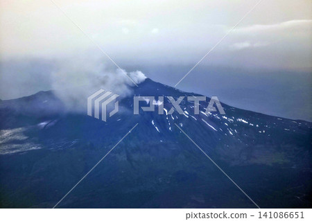 Etna volcano erupting aerial view from airplane Etna volcano erupting aerial view from airplane 141086651