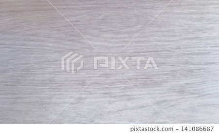 Uniform whitewashed wood flooring with horizontal light gray grain, subtle tonal variations, clean and minimal appearance. Uniform whitewashed wood flooring with horizontal light gray grain, subtle tonal variations, clean and minimal appearance. 141086687