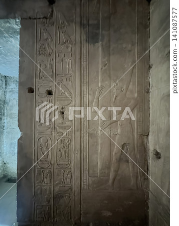 Beautiful bas-reliefs and ancient hieroglyphs in the Temple of Seti I in Abydos, Egypt. 141087577