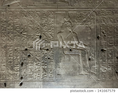 Beautiful bas-reliefs and ancient hieroglyphs in the Temple of Seti I in Abydos, Egypt. 141087579