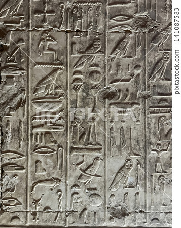 Beautiful bas-reliefs and ancient hieroglyphs in the Temple of Seti I in Abydos, Egypt. 141087583