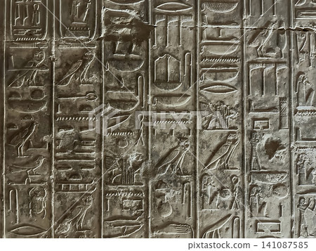Beautiful bas-reliefs and ancient hieroglyphs in the Temple of Seti I in Abydos, Egypt. 141087585