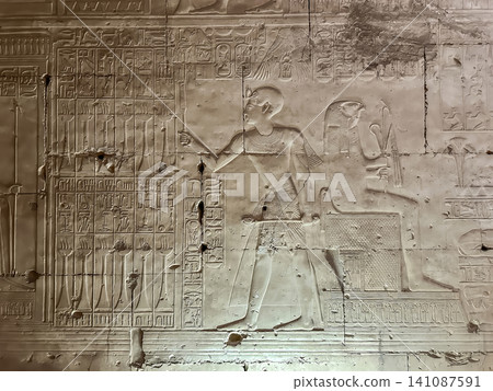 Beautiful bas-reliefs and ancient hieroglyphs in the Temple of Seti I in Abydos, Egypt. Beautiful bas-reliefs and ancient hieroglyphs in the Temple of Seti I in Abydos, Egypt. 141087591