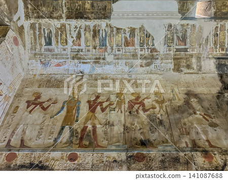 Beautiful bas-reliefs and ancient hieroglyphs in the Temple of Seti I in Abydos, Egypt. 141087688