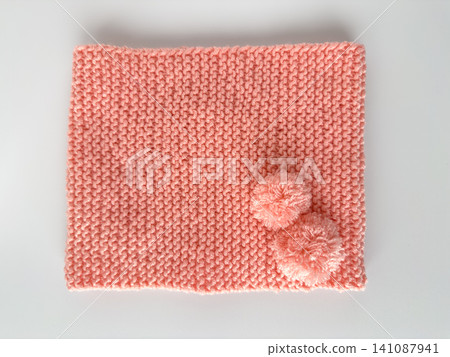 Soft pink lace knitted round scarf isolated on white background. Fashion children's accessory. Soft pink lace knitted round scarf isolated on white background. Fashion children's accessory. 141087941