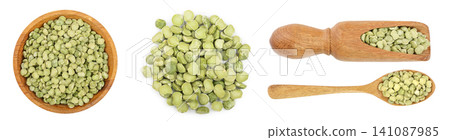 Green split peas in a wooden bowl isolated on white background. Top view Green split peas in a wooden bowl isolated on white background. Top view 141087985