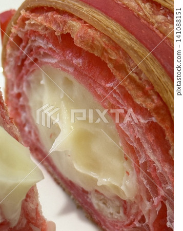 Pastry with pink crust and creamy white filling close-up, ideal for food backgrounds Pastry with pink crust and creamy white filling close-up, ideal for food backgrounds 141088151