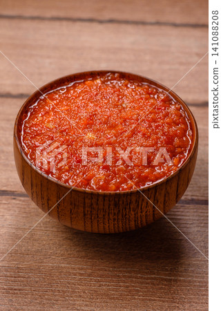 Red tomato Bolognese sauce with spices, salt, pepper, and herbs. A red sauce Red tomato Bolognese sauce with spices, salt, pepper, and herbs. A red sauce 141088208