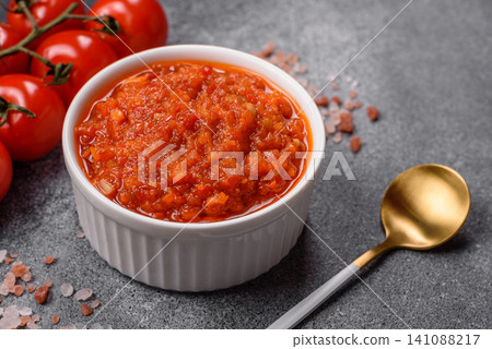 Red tomato Bolognese sauce with spices, salt, pepper, and herbs. A red sauce Red tomato Bolognese sauce with spices, salt, pepper, and herbs. A red sauce 141088217