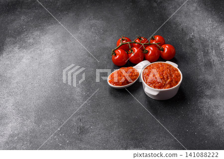 Red tomato Bolognese sauce with spices, salt, pepper, and herbs. A red sauce 141088222